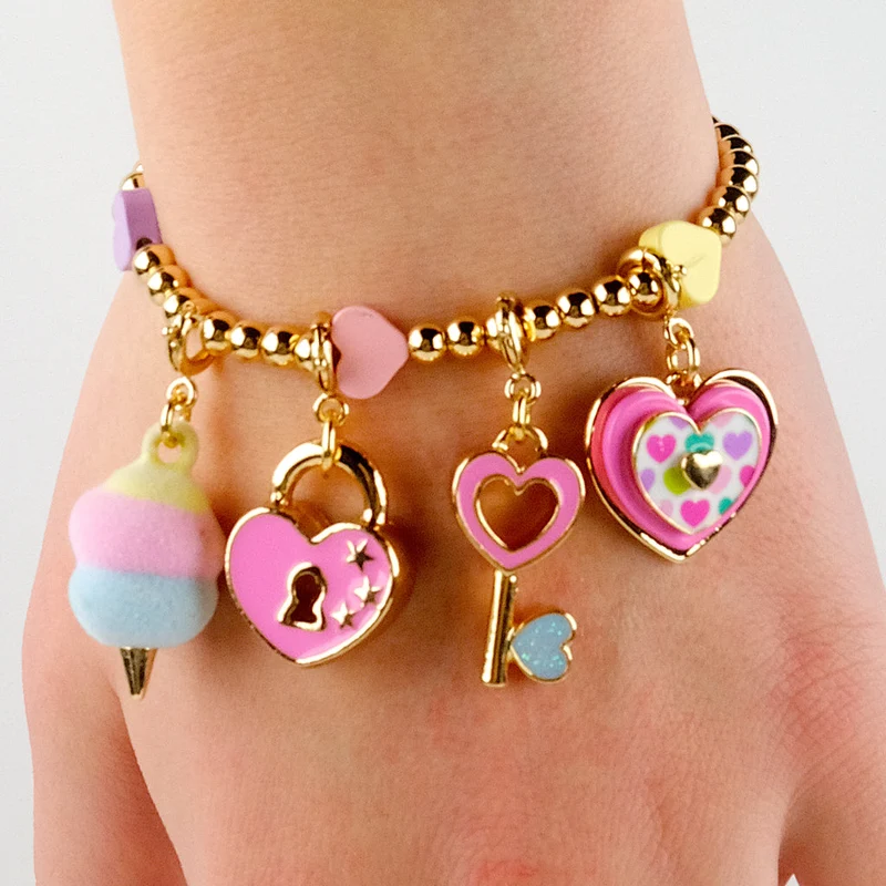 Gold Multi Heart Stretch Charm Bracelet with Enamel Bead Detail