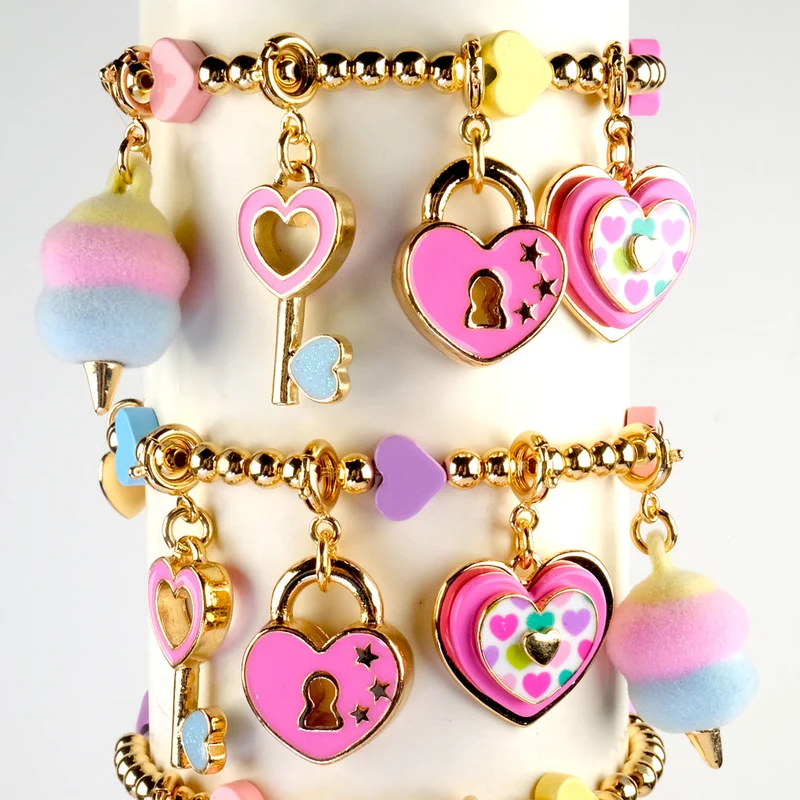 Gold Multi Heart Stretch Charm Bracelet with Enamel Bead Detail