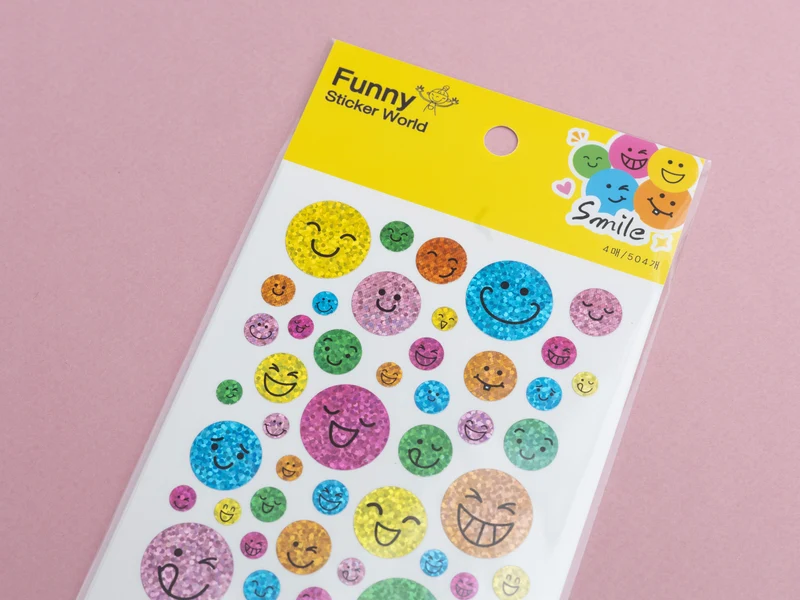 4 planches de stickers sourire holographiques